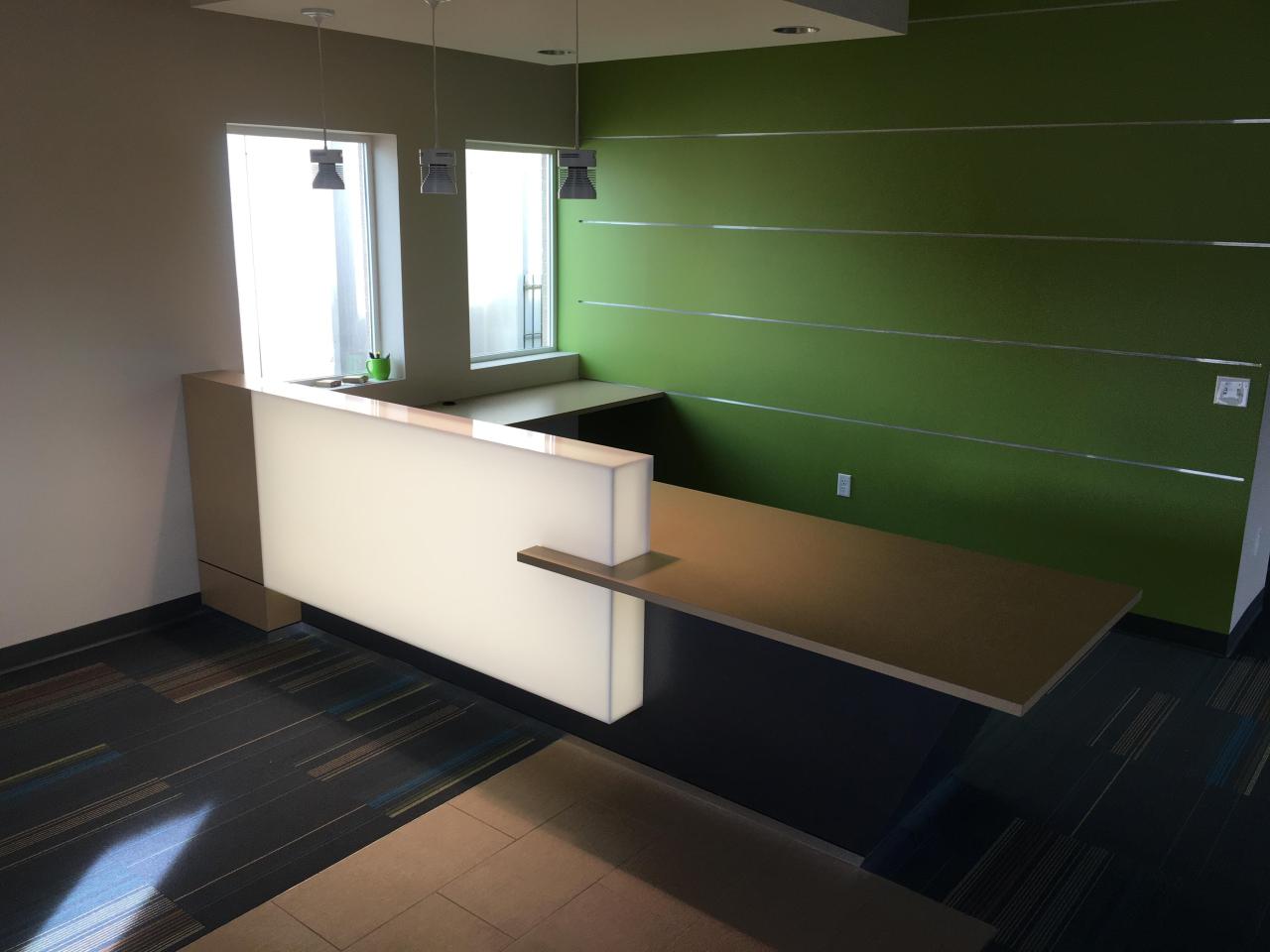 Clean, minimalist reception millwork suited for medical environments