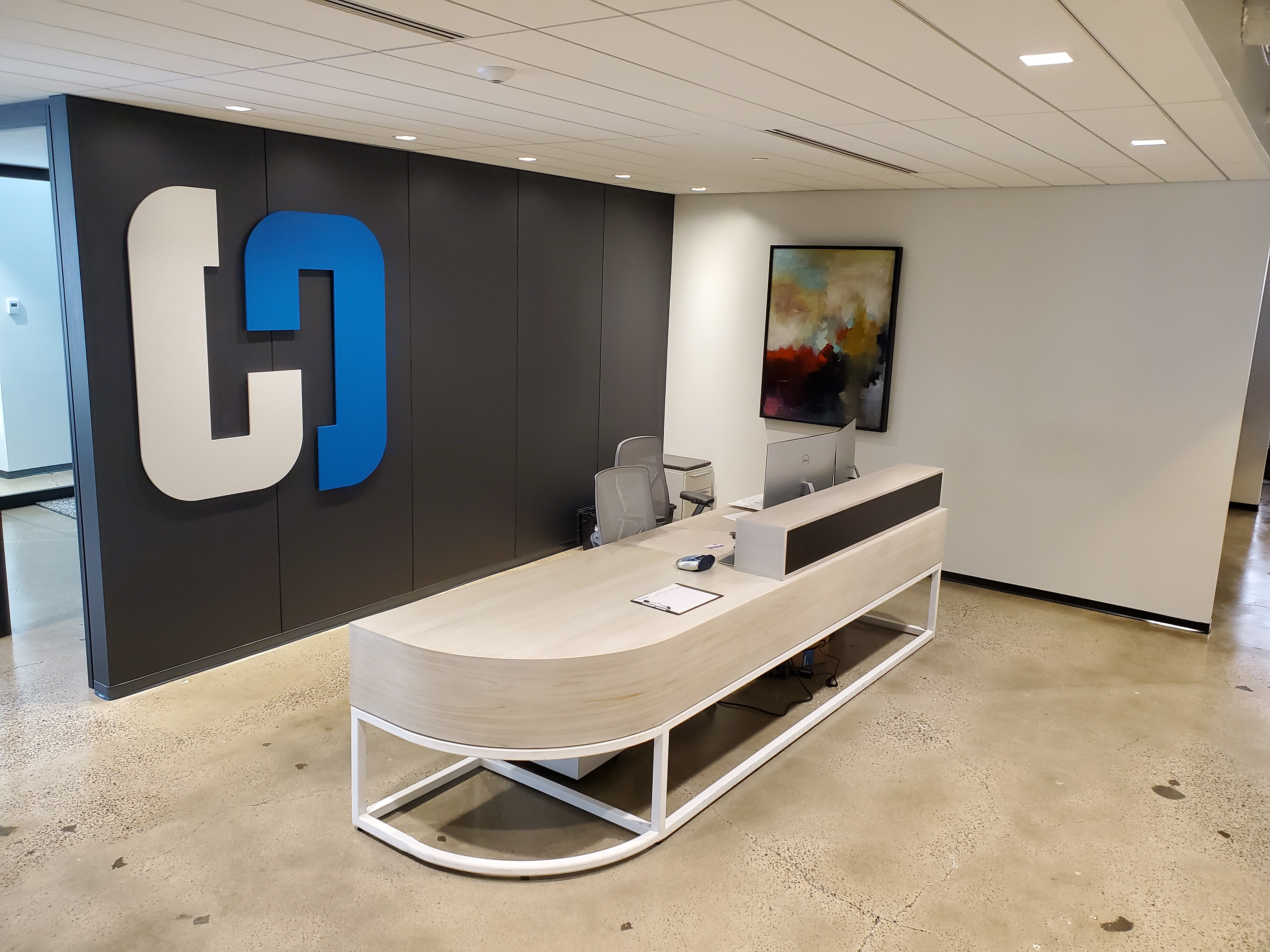 Custom signature reception desk with premium wood veneer